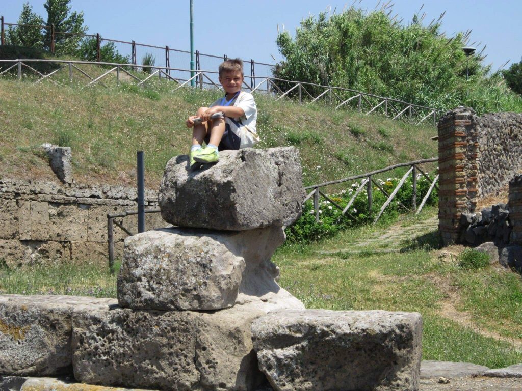 My son on a rock in pompeii